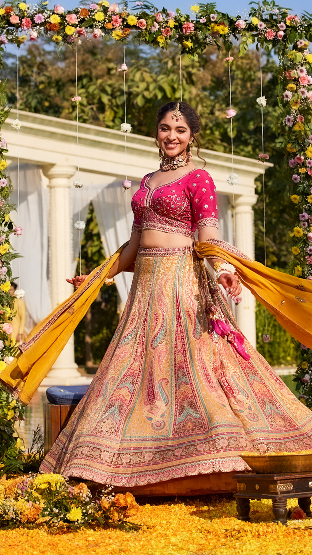 Bride wearing beautiful oink lehenga for haldi ceremony